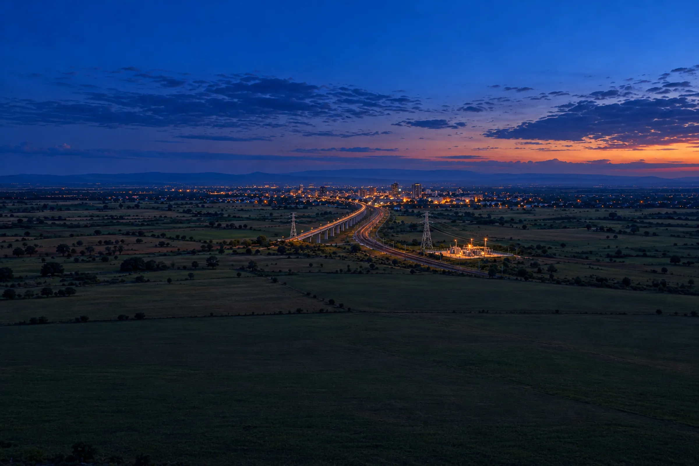 AI-generated concept of a viaduct, railway and electricity infrastructure near an African city at dusk